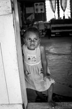 Fijian child at the doorwary to the school in the village